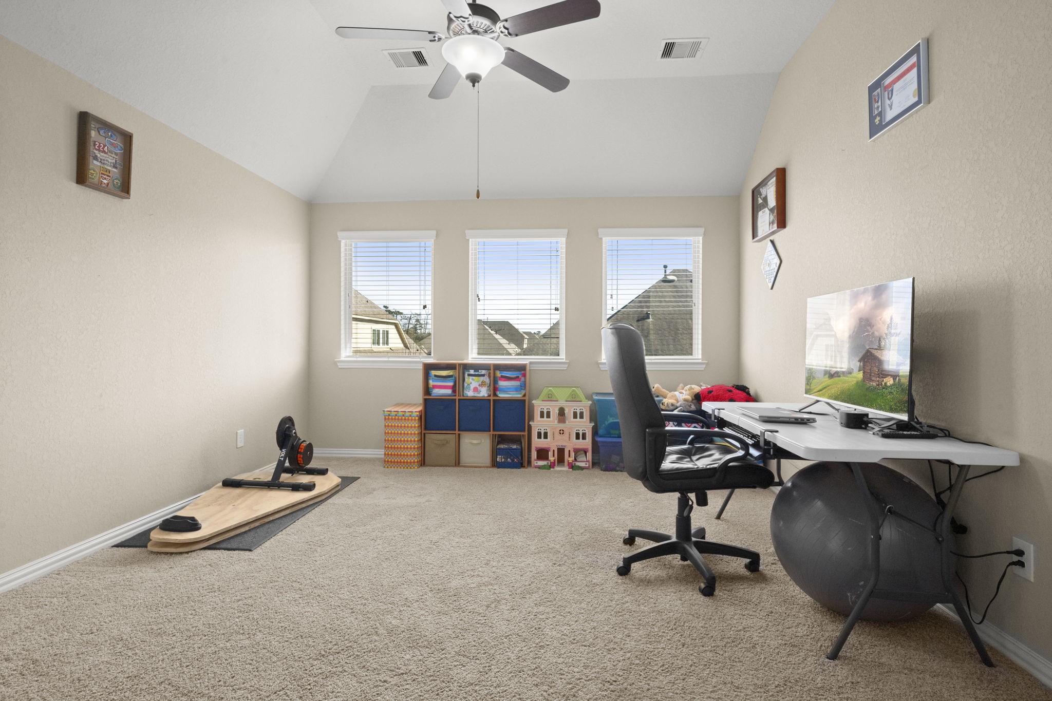 25306 Doyle Sands Court Spring, TX 77389 - Photo 26 of 35 Flexible game room filled with natural light, offering versatile use as a teen study and lounge, fitness or yoga space, home schooling or learning center, library or reading retreat, or creative studio.