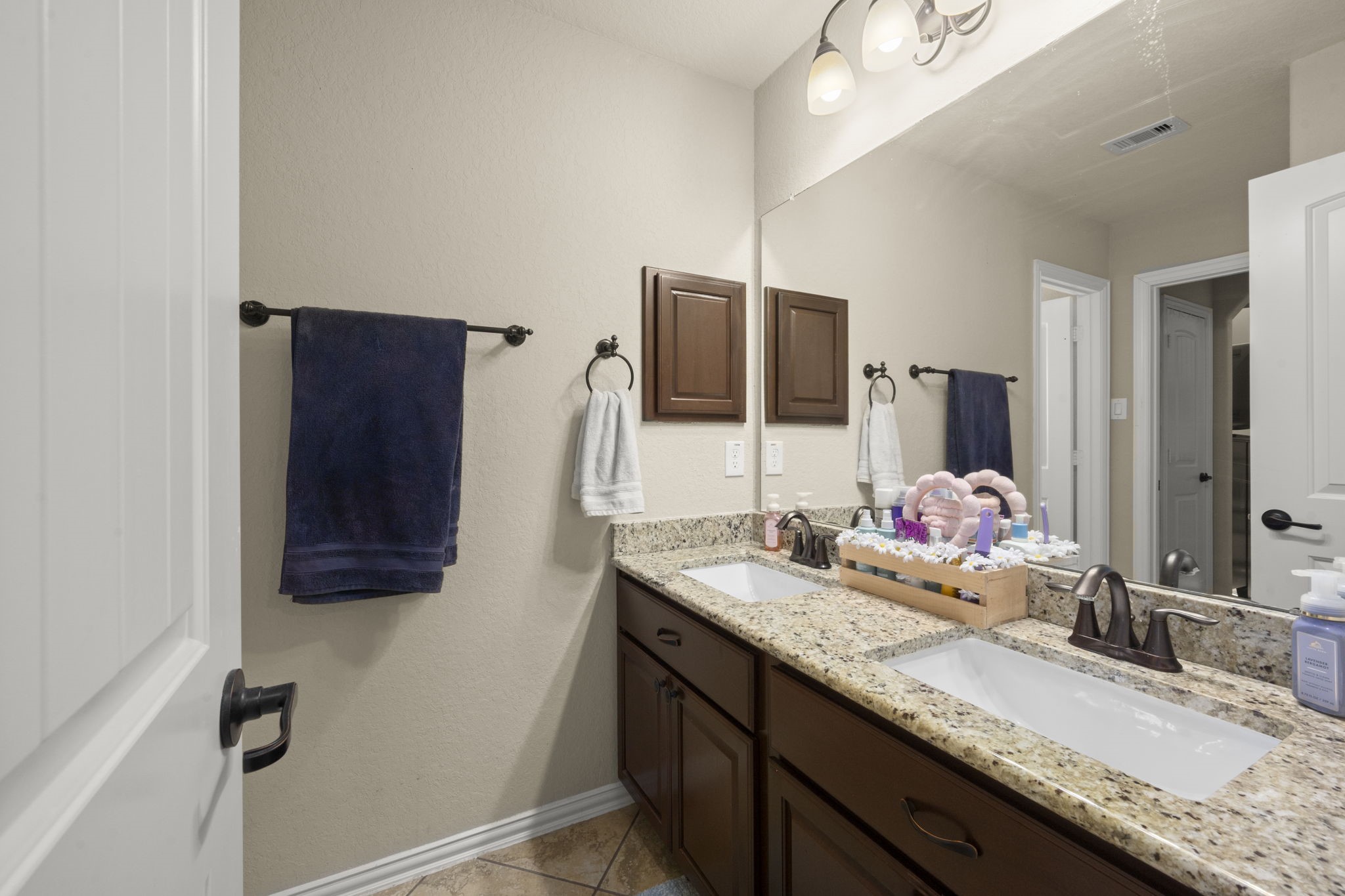 25306 Doyle Sands Court Spring, TX 77389 - Photo 30 of 35 Well-designed en suite full bathroom with double vanities, granite countertops, tub/shower combo and timeless finishes.