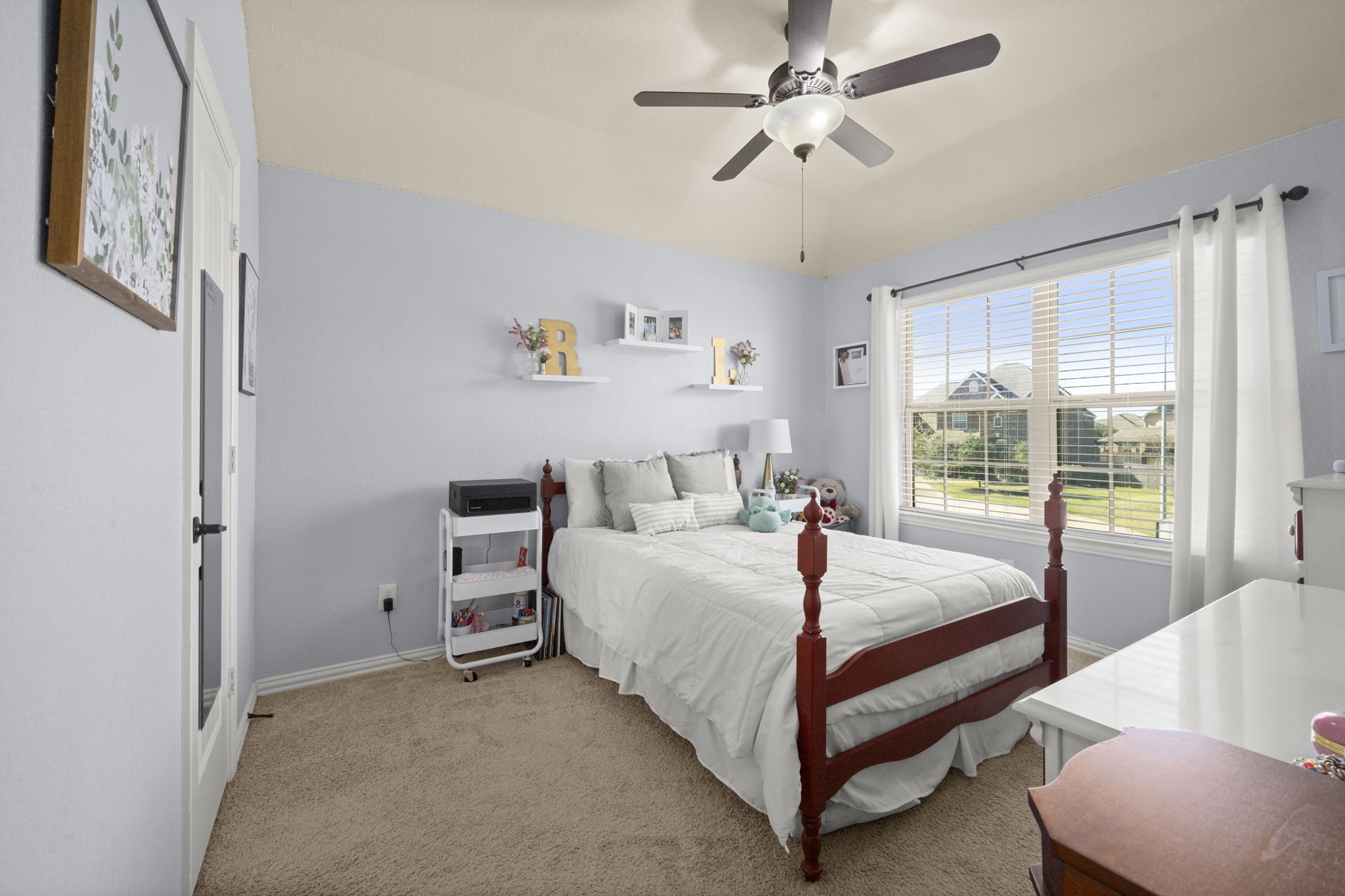 25306 Doyle Sands Court Spring, TX 77389 - Photo 31 of 35 Bright upstairs third bedroom with a large window, ceiling fan.