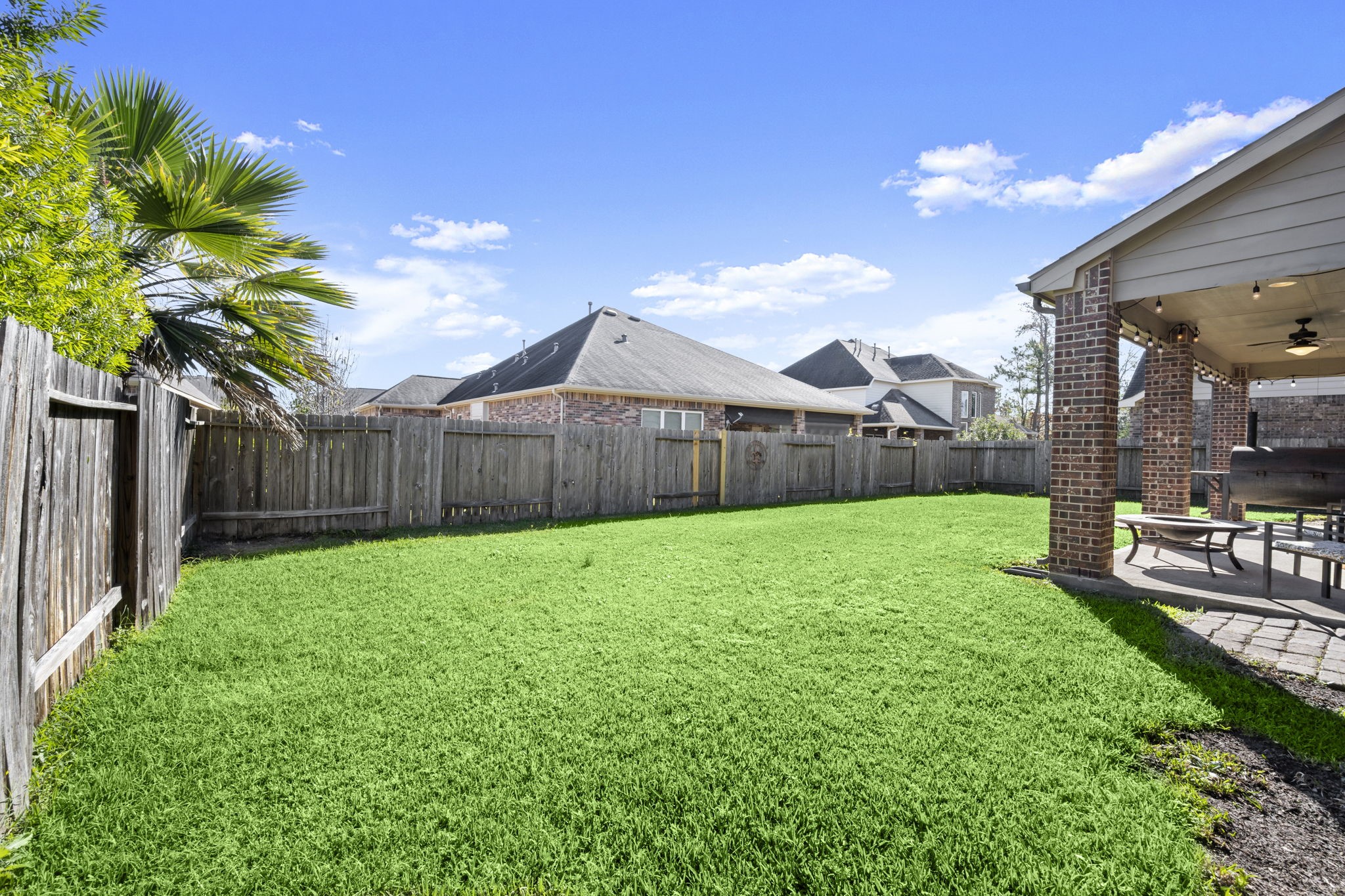 25306 Doyle Sands Court Spring, TX 77389 - Photo 34 of 35 Expansive outdoor space offering room to relax, play, and entertain, with a covered patio and fenced yard.