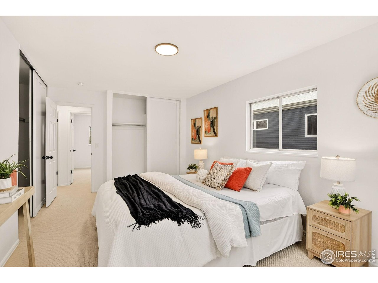 919 Vetch Circle Lafayette, CO 80026 - Photo 15 of 20 a bedroom with a bed and a night stand