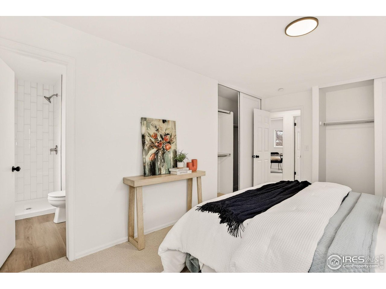 919 Vetch Circle Lafayette, CO 80026 - Photo 17 of 20 a bedroom with a bed and a cabinets