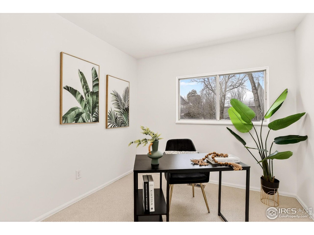 919 Vetch Circle Lafayette, CO 80026 - Photo 18 of 20 a view of a workspace with furniture and a potted plant