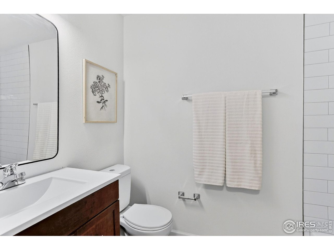 919 Vetch Circle Lafayette, CO 80026 - Photo 19 of 20 a bathroom with a sink a toilet and mirror