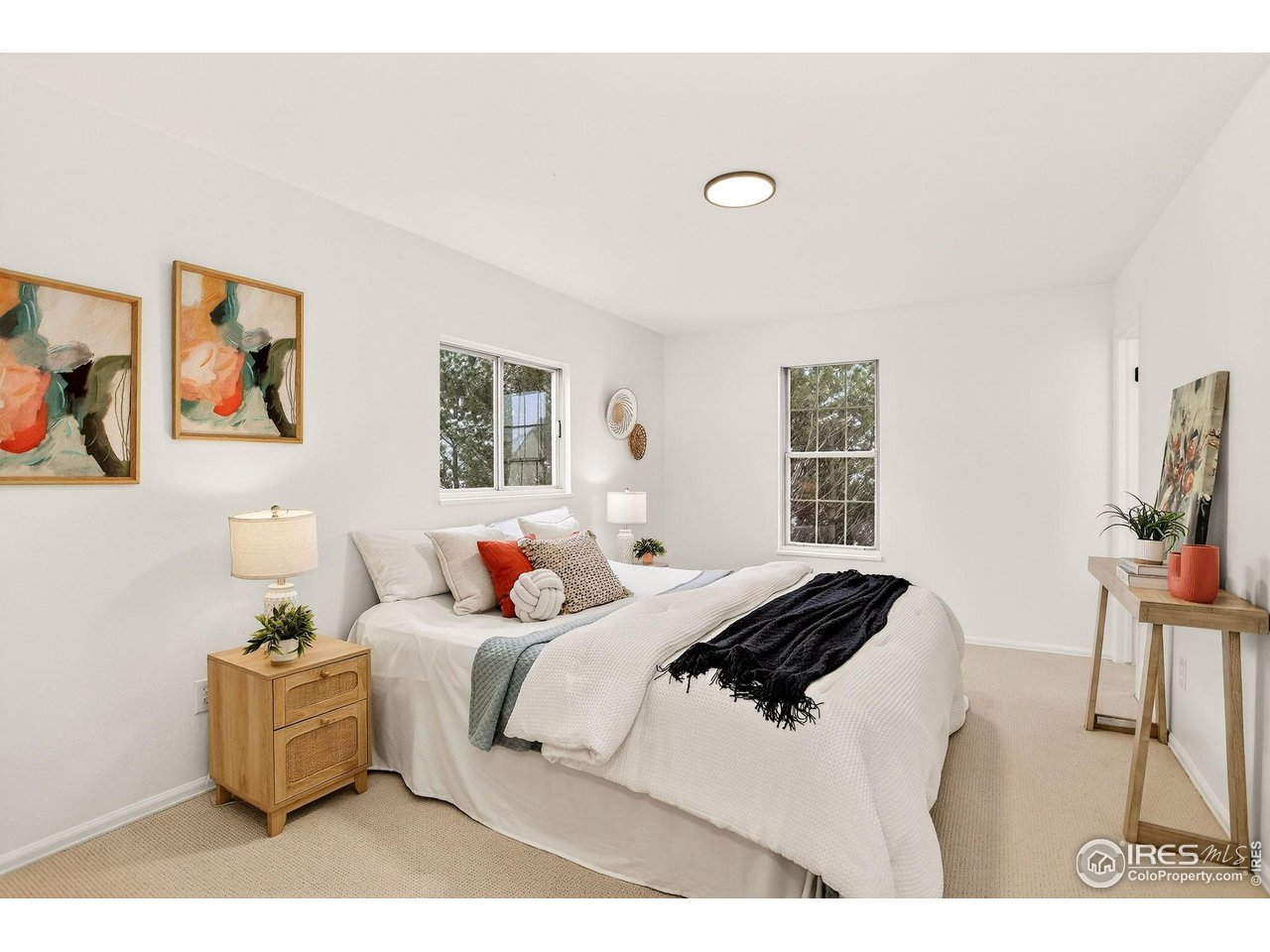 919 Vetch Circle Lafayette, CO 80026 - Photo 5 of 20 a bedroom with a bed and a chair