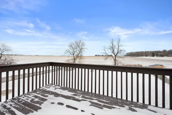a view of a balcony with wooden floor