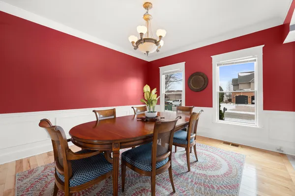 a view of a dining room with furniture and window