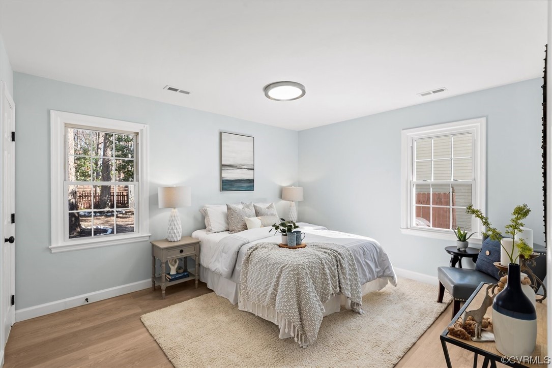 713 Goodwood Road Richmond, VA 23225 - Photo 13 of 29 a bedroom with a bed and wooden floor