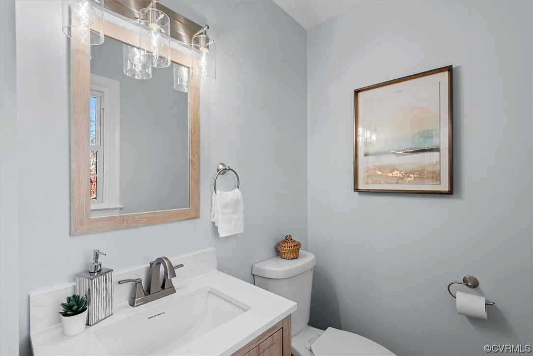 713 Goodwood Road Richmond, VA 23225 - Photo 15 of 29 a bathroom with a toilet sink and mirror