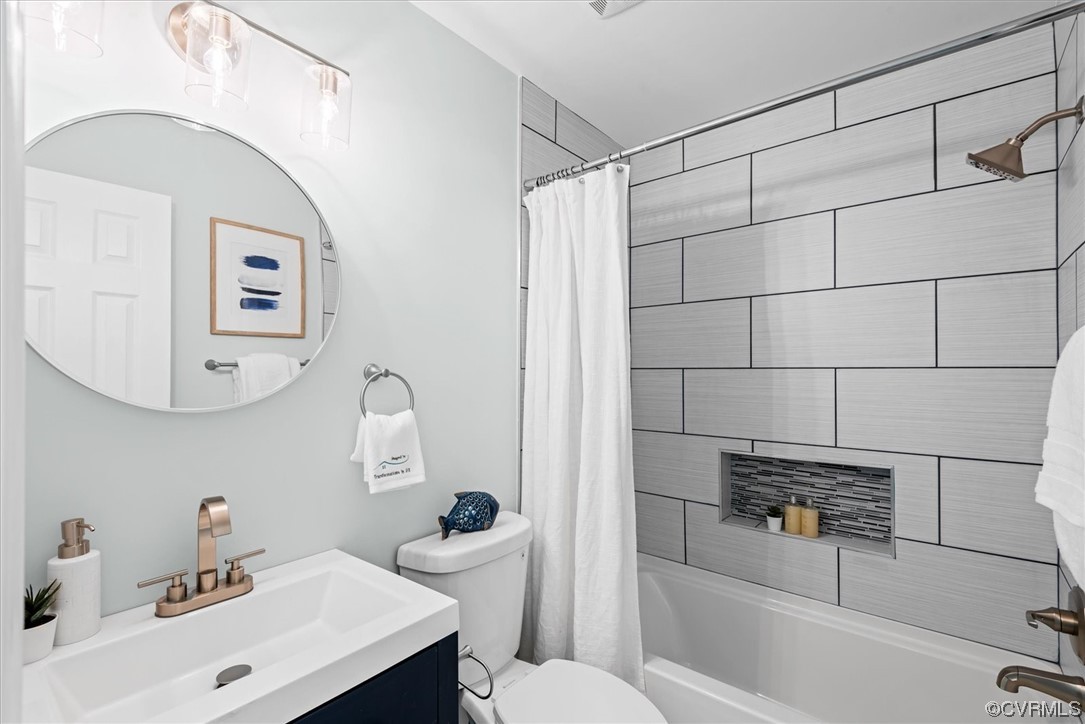 713 Goodwood Road Richmond, VA 23225 - Photo 20 of 29 a bathroom with a sink toilet and shower
