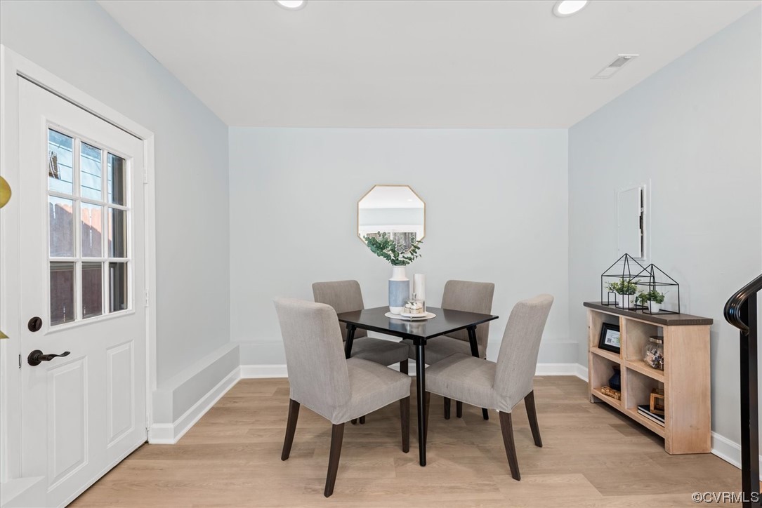 713 Goodwood Road Richmond, VA 23225 - Photo 22 of 29 a view of a dining room with furniture and wooden floor