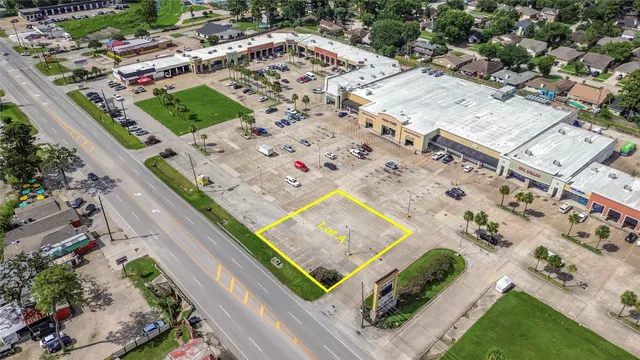 an aerial view of a house with a swimming pool