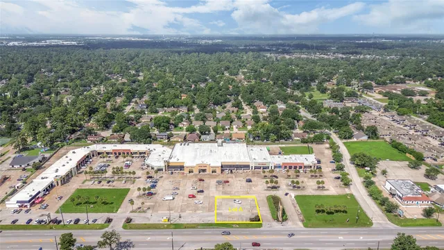 an aerial view of a residential houses with outdoor space