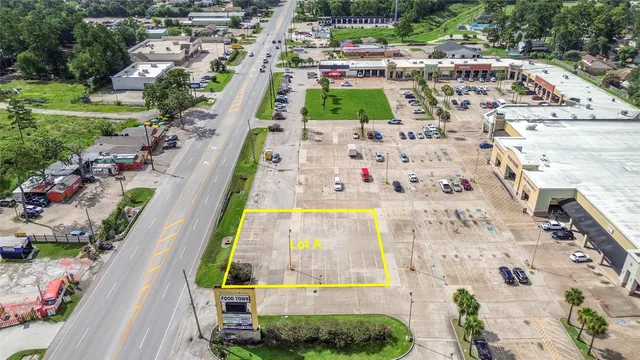 a backyard of a house with basket ball court and outdoor seating