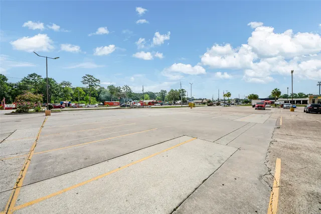 a view of a parking space and a car parked in front of it