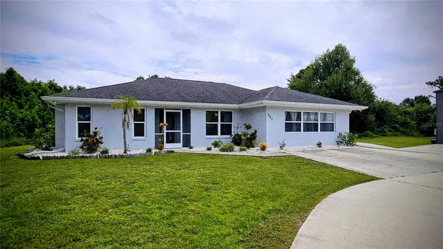 a front view of a house with a garden and porch