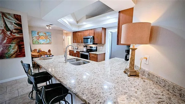 a living room with furniture and a lamp