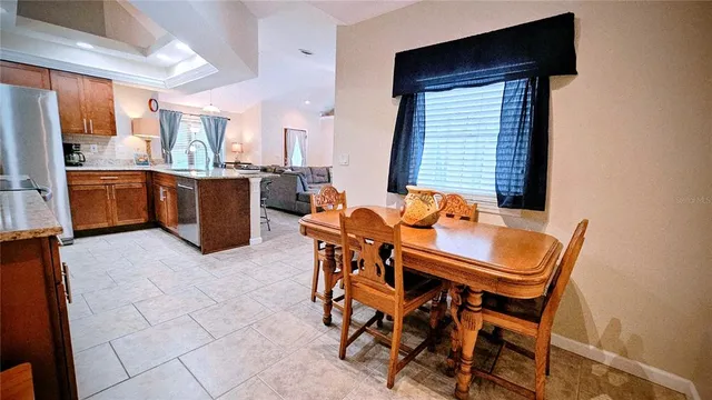 a view of a dining room with furniture