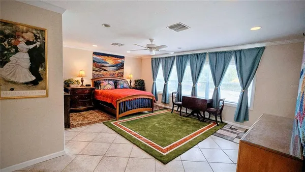 a bedroom with furniture and window