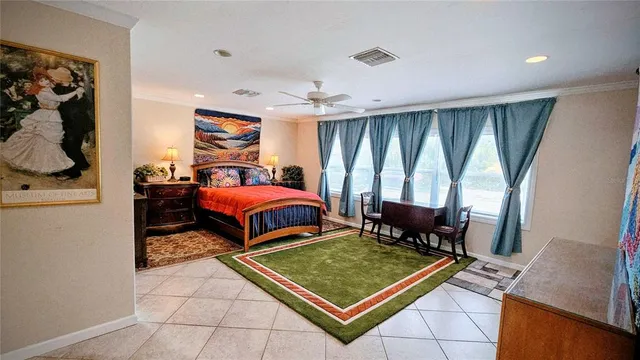 a bedroom with furniture and window