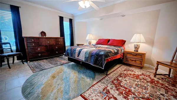 a bedroom with a bed and a dresser in it