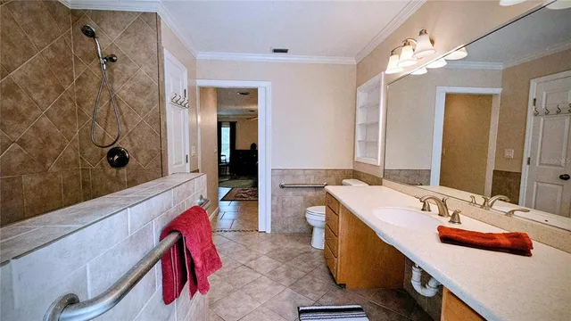 a bathroom with a tub sink and mirror