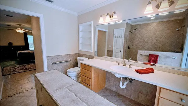 a bathroom with a sink double vanity and a mirror
