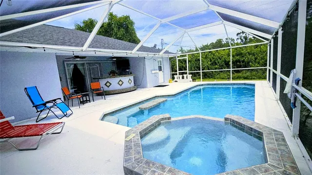 a view of a swimming pool with a lounge chairs