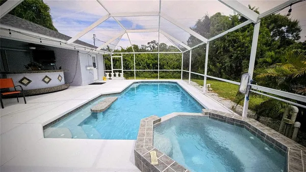 a view of a living room and a flat screen tv
