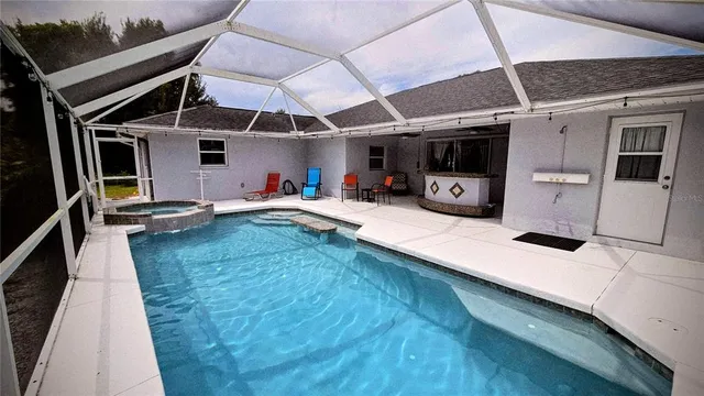 a view of a backyard with furniture and storage