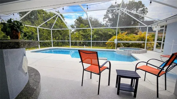 a view of a chairs and table in the patio