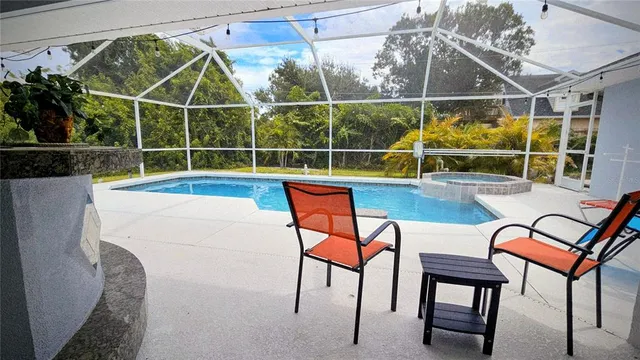 a view of a chairs and table in the patio