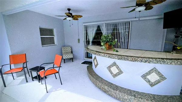 a workspace with furniture and a chandelier