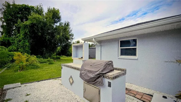 a view of backyard with seating space
