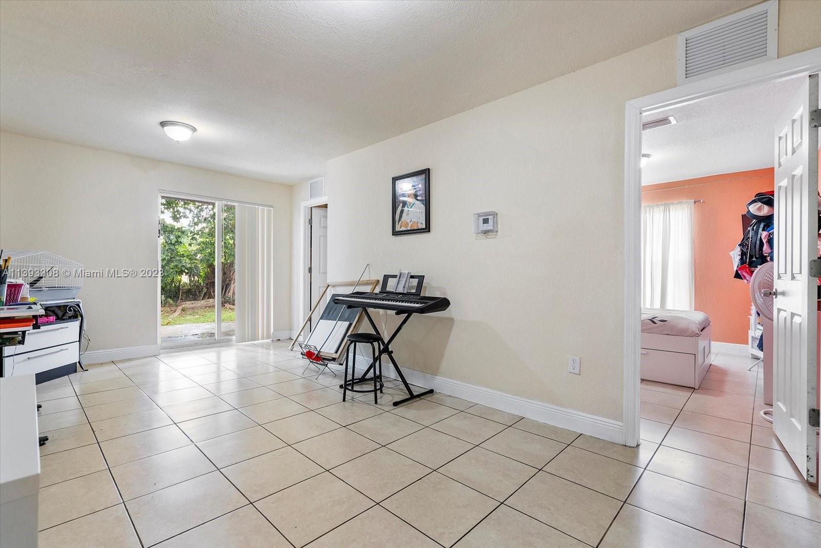 11750 Southwest 223rd Street Miami, FL 33170 - Photo 13 of 28 a view of a workspace with furniture and a window