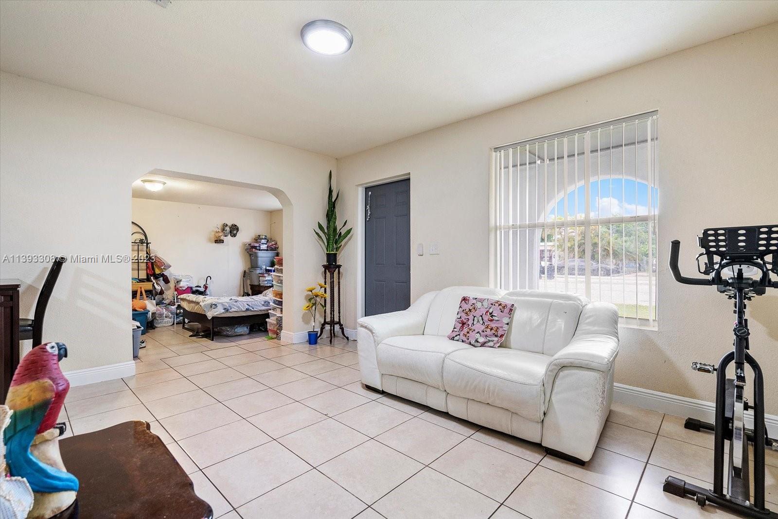 11750 Southwest 223rd Street Miami, FL 33170 - Photo 10 of 28 a living room with furniture and a large window