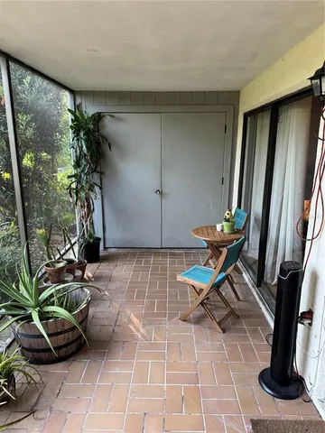 a view of a entryway with flower pots