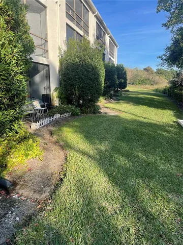 a view of swimming pool is middle in the garden