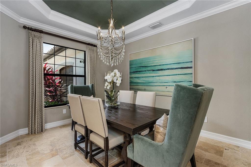 3423 Runaway Court Naples, FL 34114 - Photo 11 of 35 a view of a dining room with furniture window and chandelier