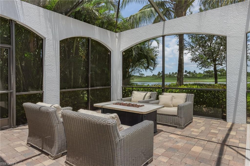 3423 Runaway Court Naples, FL 34114 - Photo 17 of 35 a view of a patio with couches chairs and a table