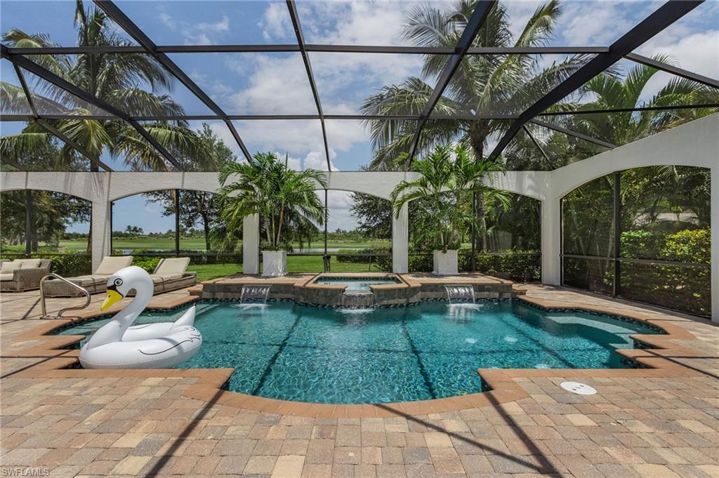 3423 Runaway Court Naples, FL 34114 - Photo 20 of 35 a view of a swimming pool with a patio