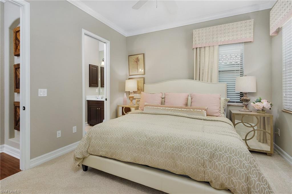 3423 Runaway Court Naples, FL 34114 - Photo 32 of 35 a bedroom with a bed and a couch