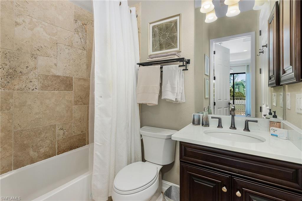 3423 Runaway Court Naples, FL 34114 - Photo 35 of 35 a bathroom with a sink a toilet and shower