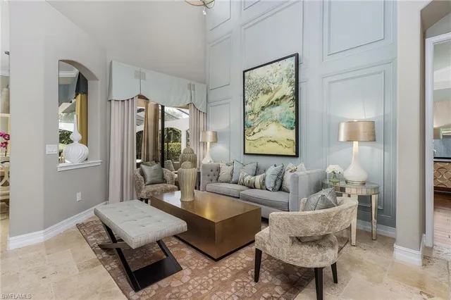 a living room with furniture and a table