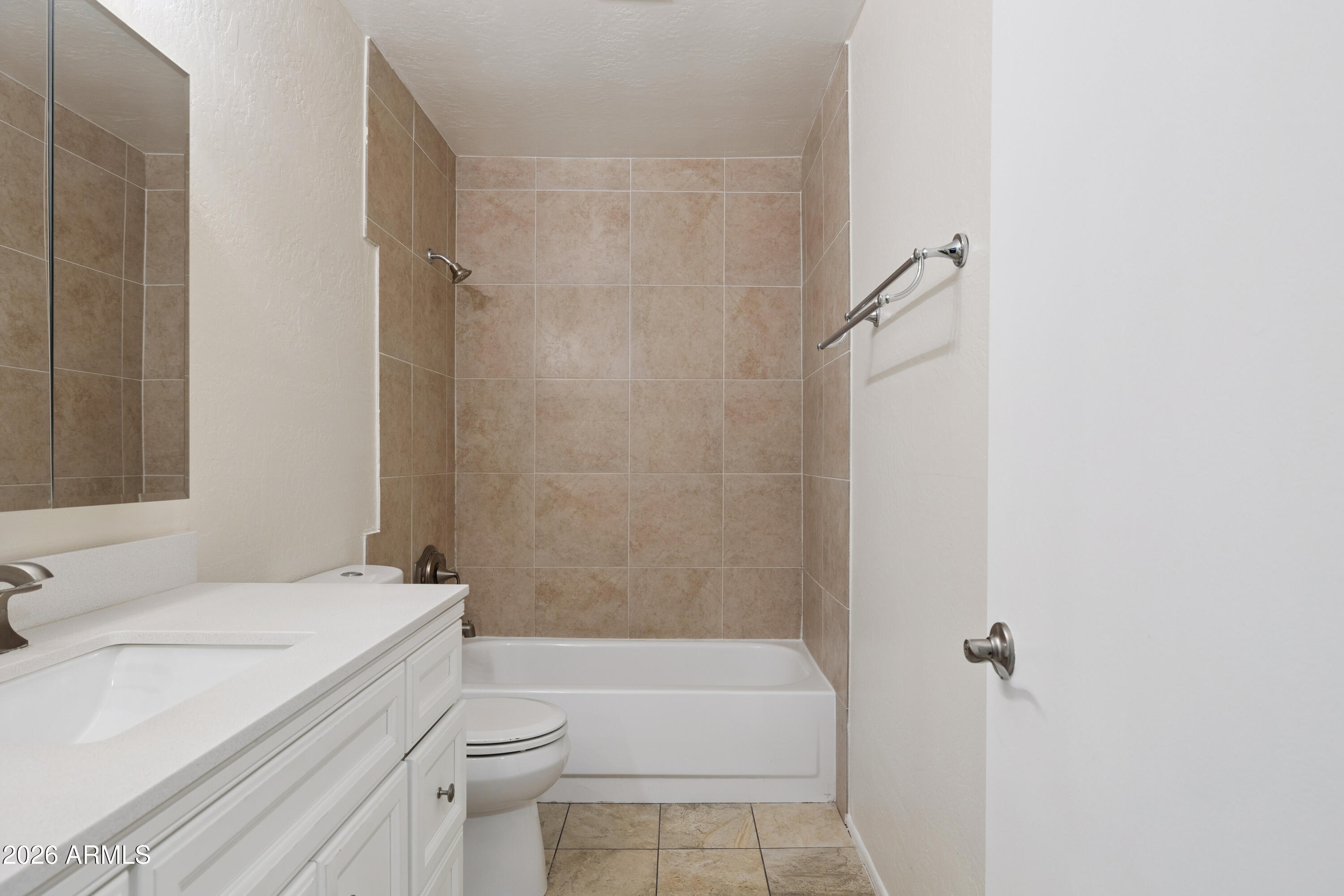 4343 East Osborn Road Phoenix, AZ 85018 - Photo 19 of 41 a bathroom with a granite countertop sink toilet and shower