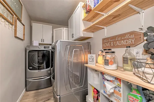 a bathroom with a sink a mirror and a shower