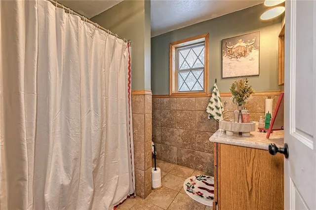 a room with furniture a rug and a window