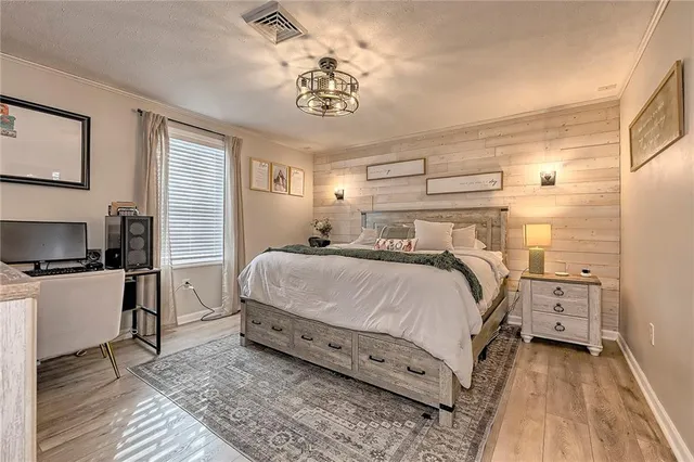 a bedroom with a bed and window