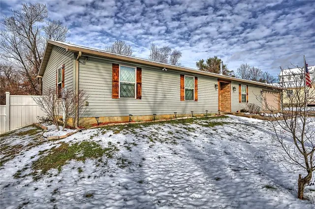 a front view of a house with a garage