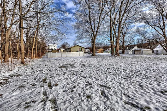 a view of house with a yard